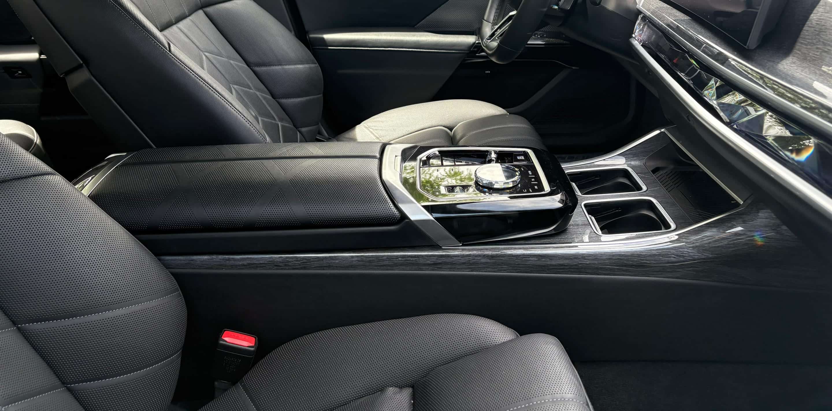 A finished black-leather cabin and polished center console — the standard a home base sets.
