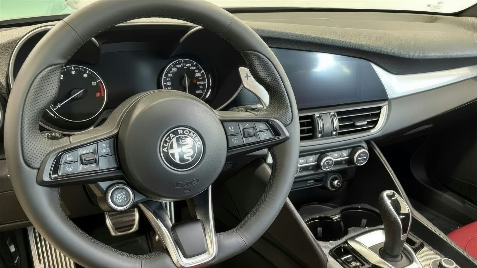 A daily driver's cockpit cleared of the week's miles.