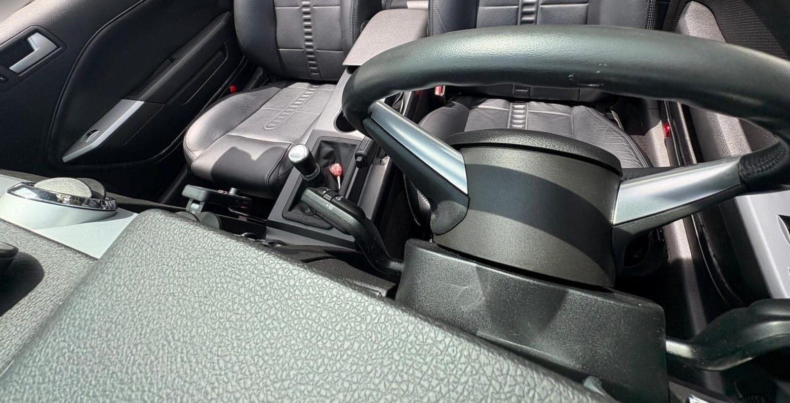 A convertible's gray cabin cleaned after a season of open-top miles.