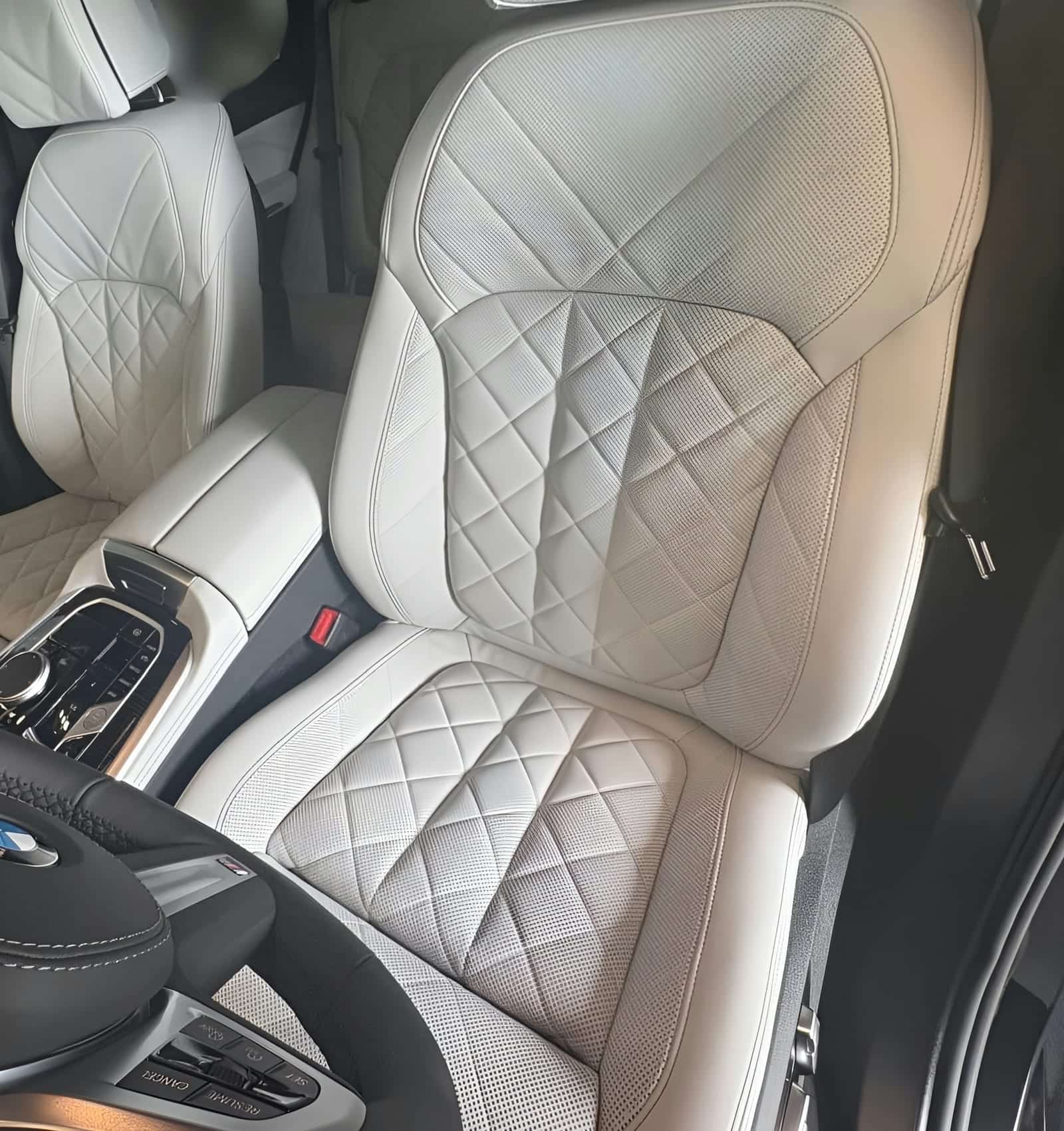 Ivory diamond-quilted leather, immaculate after seam-by-seam conditioning.