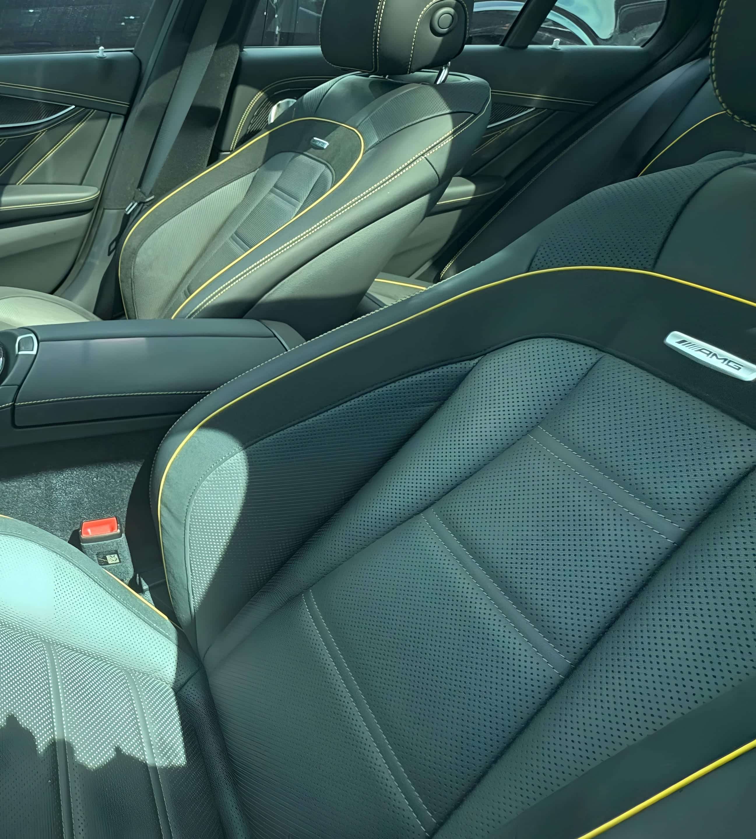 Deep-cleaned black leather sport seats with contrast stitching